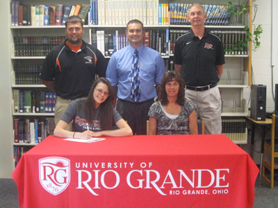 Whiteoak High School�s Clarissa Johnson is joined by family, coaches and administrators after signing with Rio Grande